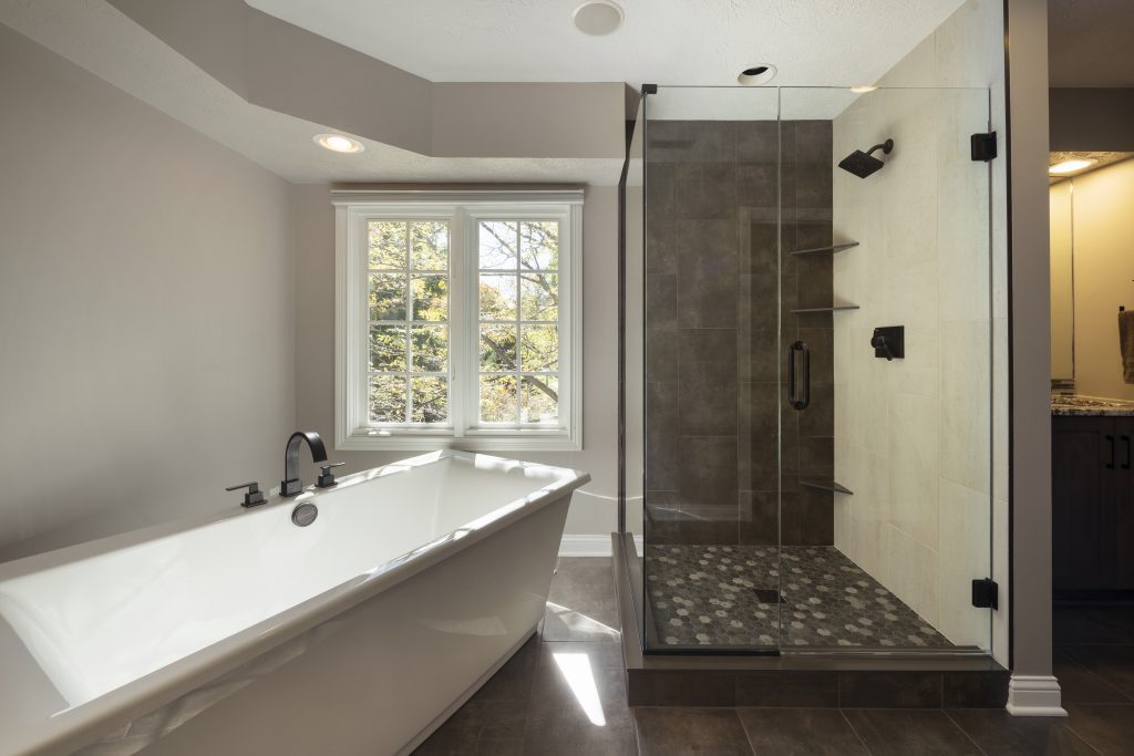 master bath with separate tub and shower