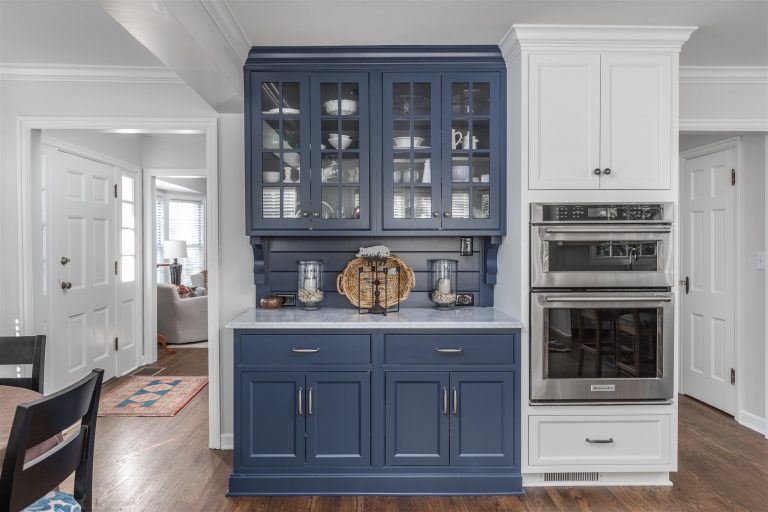 the poplar cabinets in this cape cod kitchen, including this butler's pantry, were a tranquil shade of blue