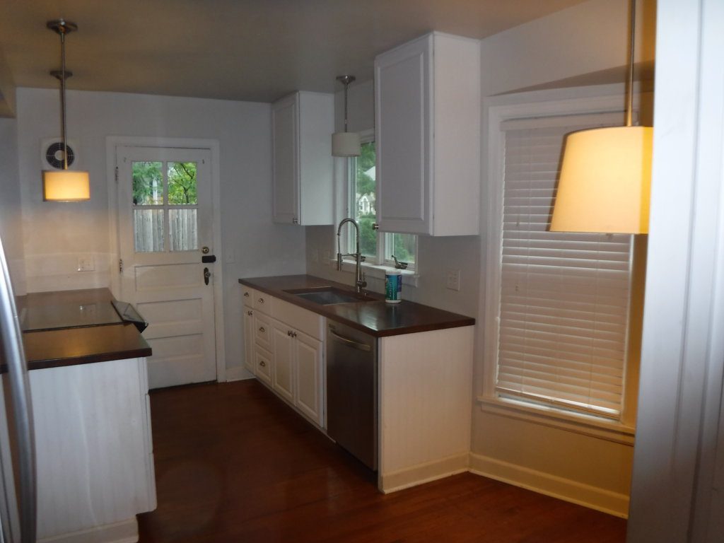 before, this cape cod kitchen was closed off to the rest of the home