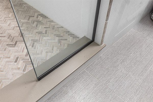 flooring trends in bathroom remodeling - gray large format tile