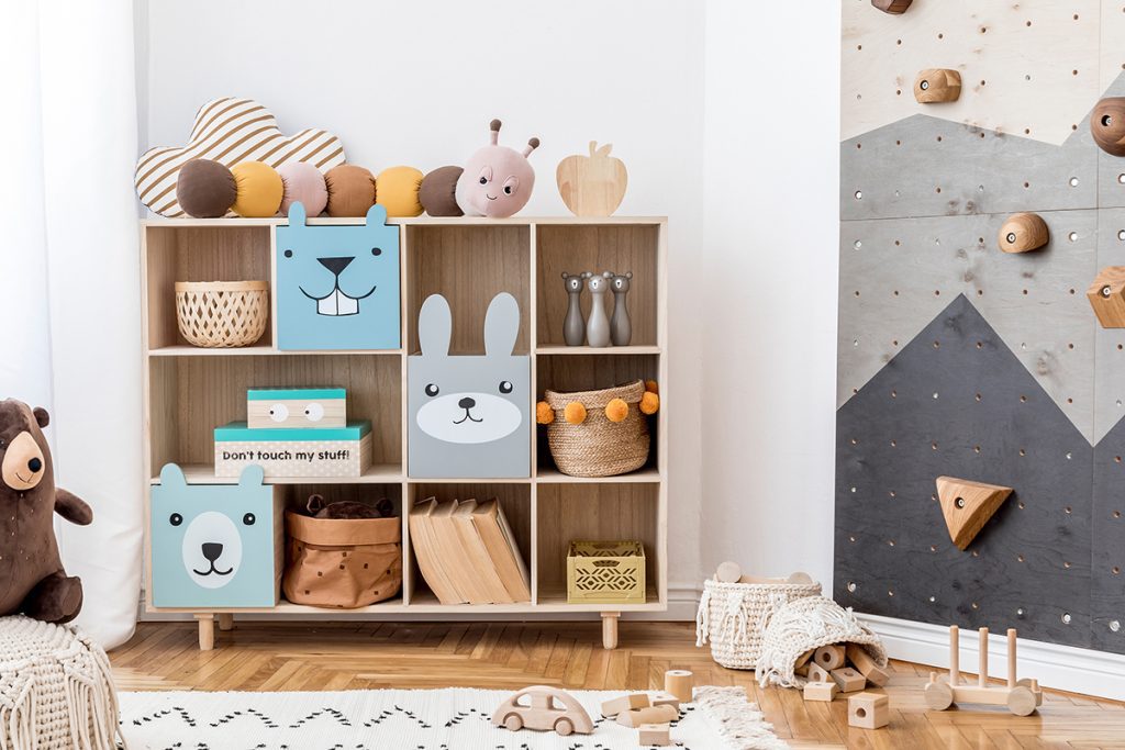 a kids room home remodel with shelves and climbing wall