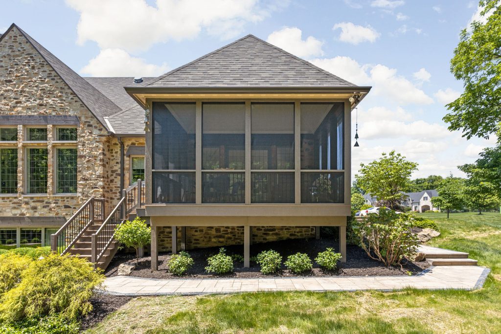 the front of this screened in porch was remodeled to better match the exterior of the home