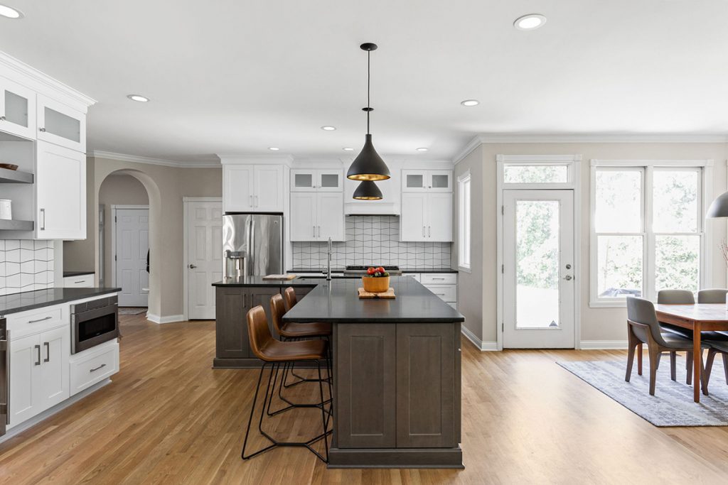 before the kitchen design and remodel, this space had a smaller island set at an angle. to maximize space, the northside indy clients expanded the size of the island