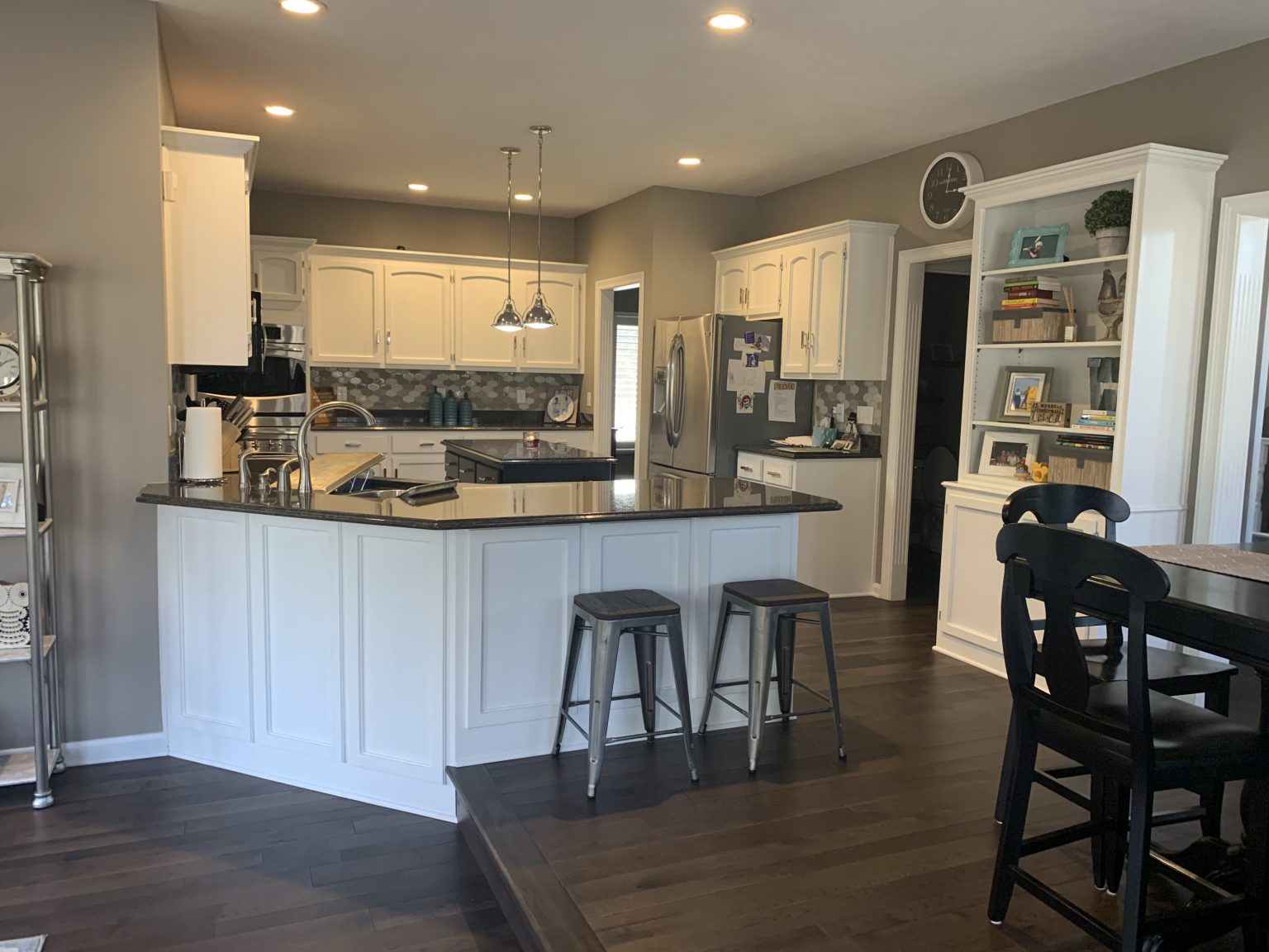 a zionsville kitchen before the remodel with white cabinetry the akward placement felt disjointed from the overall footprint.