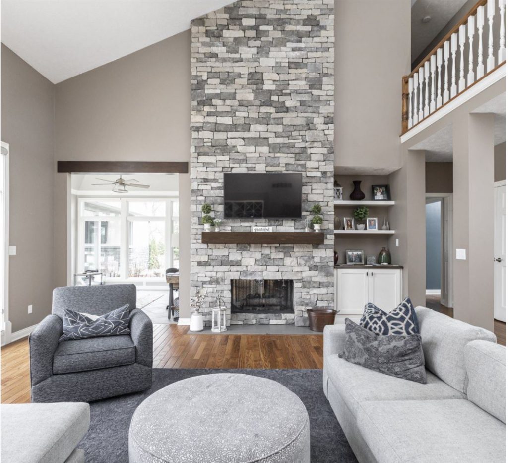 floor to ceiling stacked stone fireplace renovation