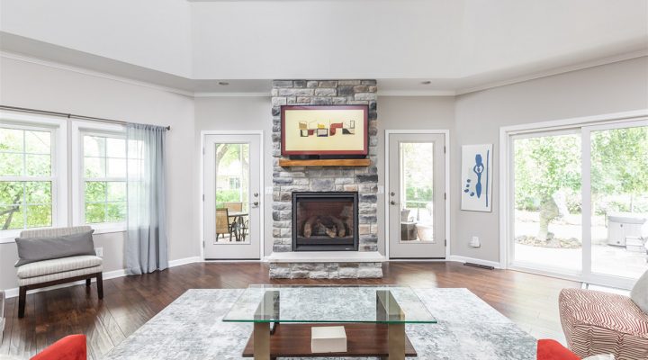 the-newly-renovated-fireplace-sits-in-the-great-room-ample-seating-surrounds-the-fireplace-and-the-television-helping-these-homeowners-create-a-cozy-environment-for-any-evening