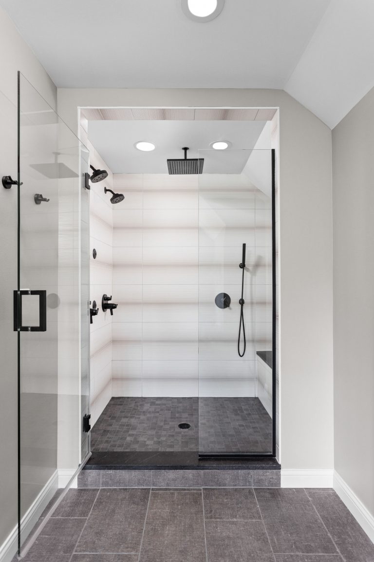 The walk-in shower was updated with ceramic tile and a frameless door