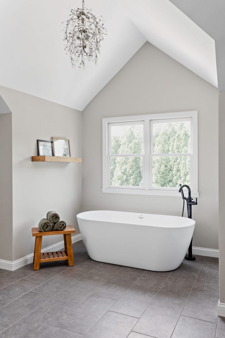 the freestanding tub fits well into this nook near the window