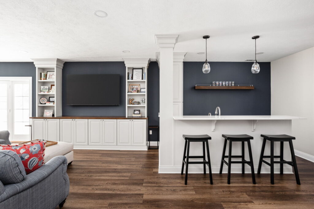 Carmel basement remodel with built-in media cabinetry and a bar