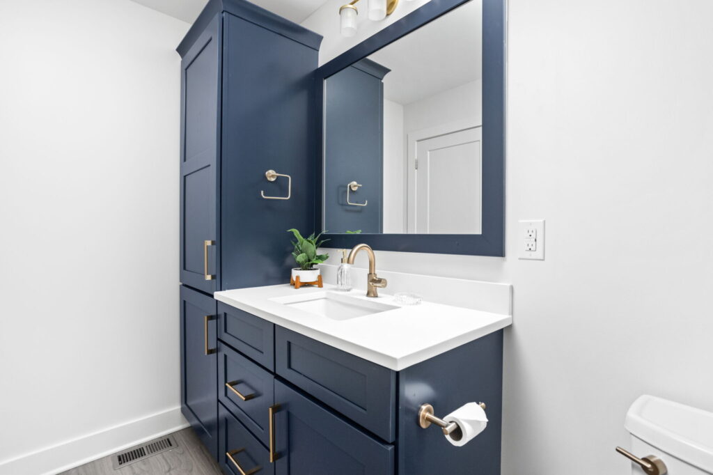bathroom remodel with blue cabinetry and white walls in Indianapolis, IN