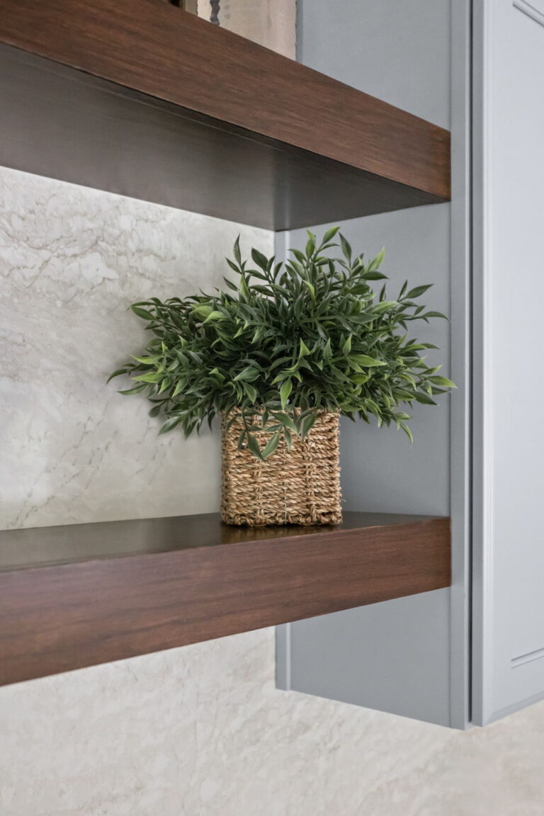 Carmel kitchen renovation refresh featuring refinished cabinetry, new buffet, bold tile, and timeless upgrades by Worthington Design & Remodeling. Photo shows close up of open wood stained shelving.