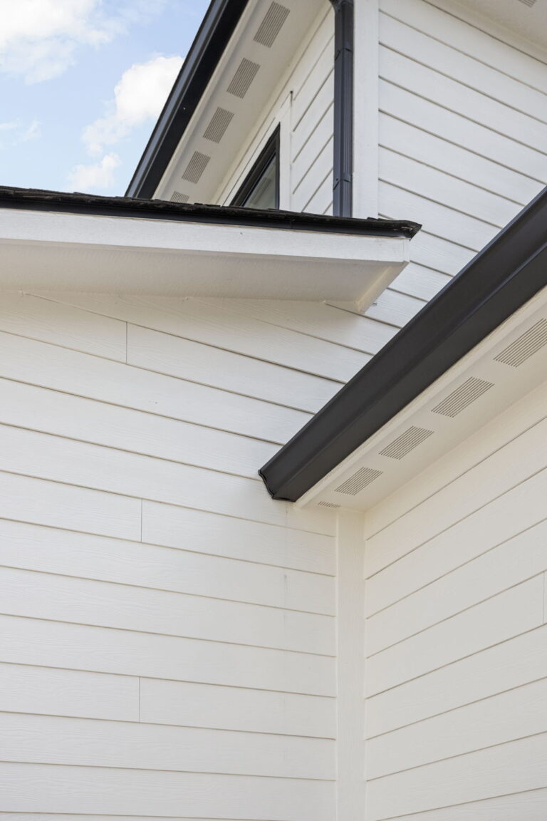 Close-up of white siding and exterior trim in garage addition by home addition contractor Carmel IN.