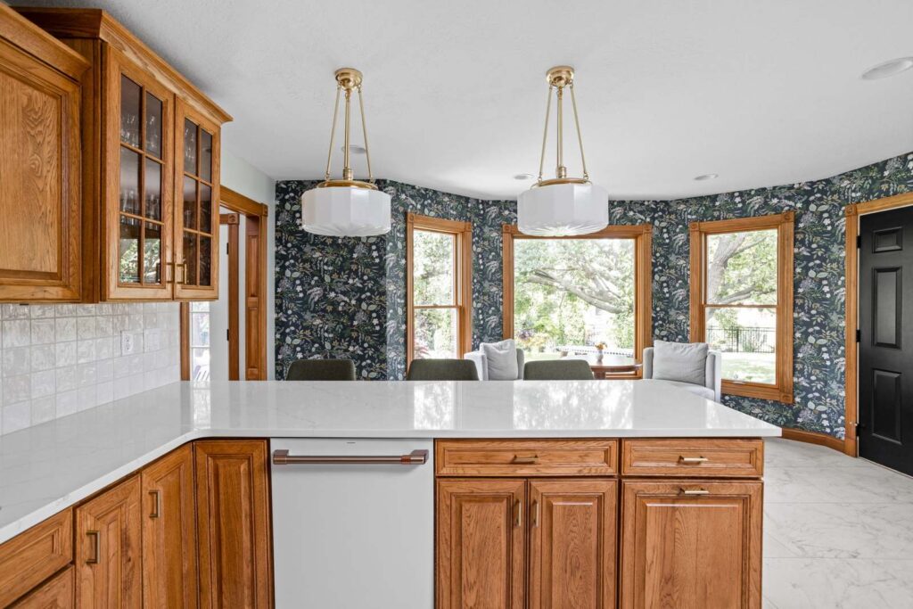 Kitchen perspective focusing on cabinetry details and finishes that maintain warmth while feeling updated.