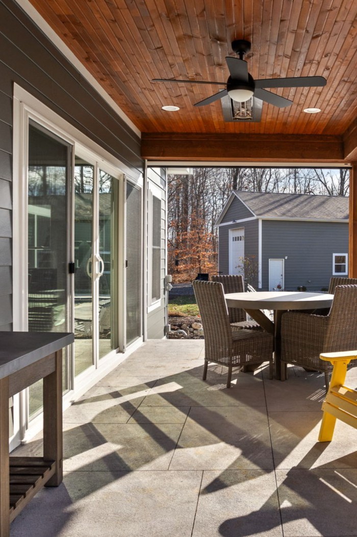 Covered patio ceiling fan and wood plank ceiling detail, four season room addition.