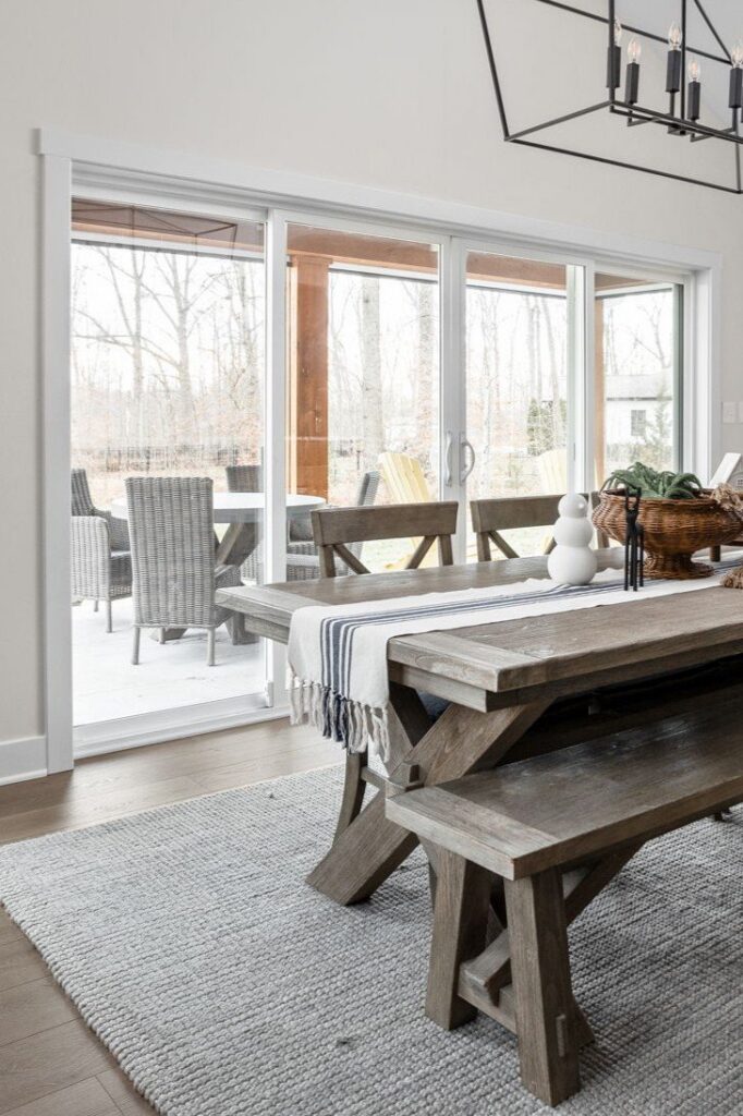 Dining area with large sliding glass door opening to the covered patio, four season room addition.