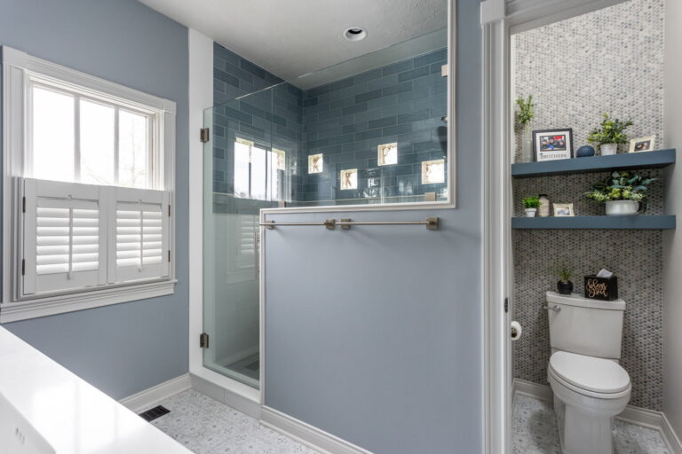walk in shower with blue and white tile in primary bathroom remodel Brownsburg Indiana