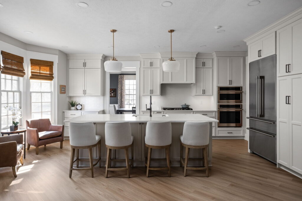 White kitchen remodel with a large island and seating