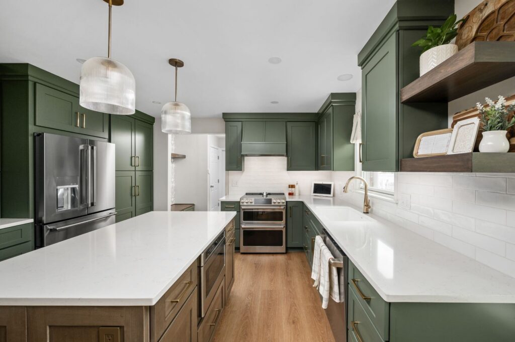 Finished custom kitchen remodel in Carmel with Rosemary Aspect maple cabinetry, MSI Quartz Carrara Breve countertops, Brunette island cabinetry, and Honey Bronze hardware.