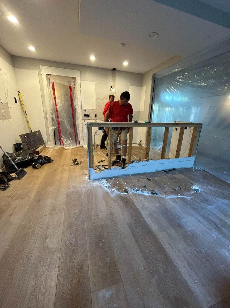 During construction: West Clary kitchen with the original island removed and framing exposed during demolition.